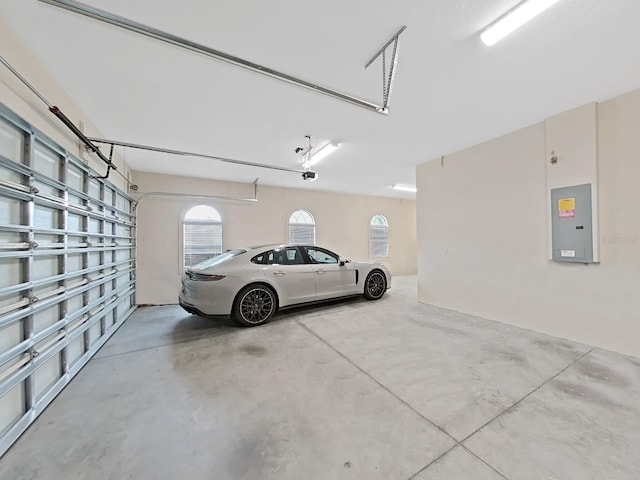 1312 Fishing Lake Dr, Odessa, FL 33556 - garage with electric panel and a garage door opener
