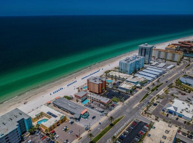 aerial view featuring a water view, a city view, and a view of the beach