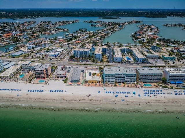bird's eye view with a water view and a view of the beach