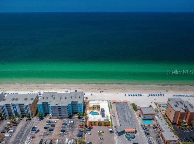 birds eye view of property featuring a view of the beach and a water view