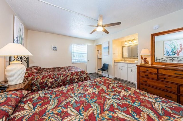 bedroom featuring connected bathroom and ceiling fan
