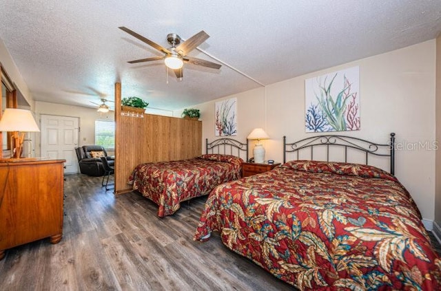 bedroom featuring a textured ceiling and wood finished floors
