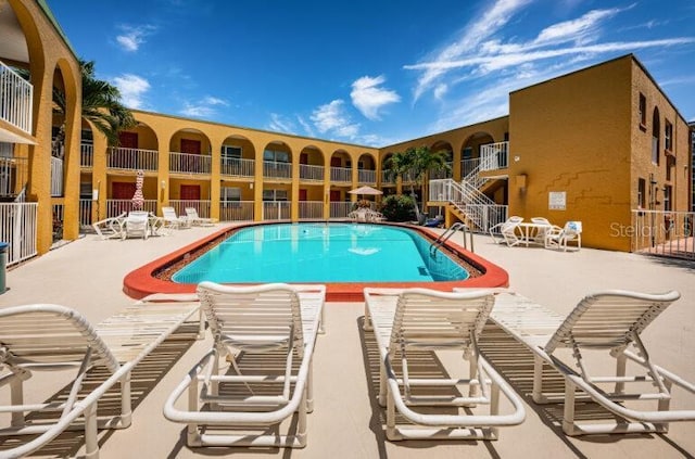 community pool with a patio