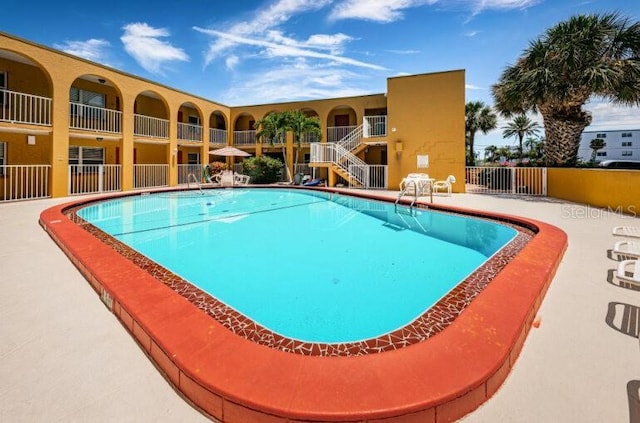community pool featuring fence