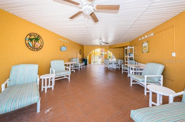 living area featuring ceiling fan