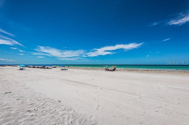 property view of water featuring a beach view