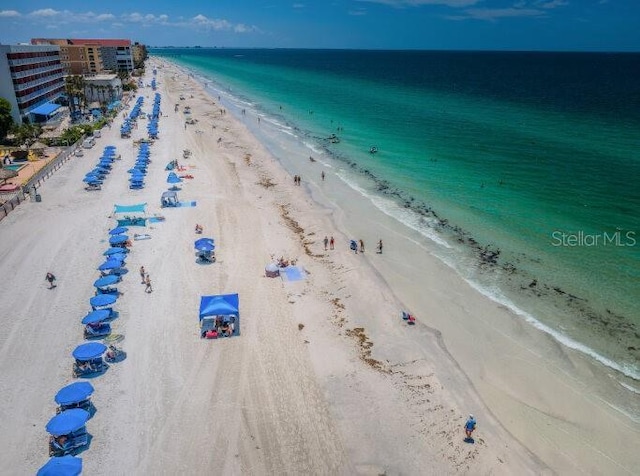 aerial view featuring a view of the beach and a water view