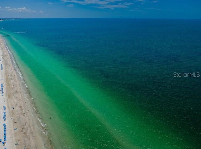 drone / aerial view with a water view and a view of the beach