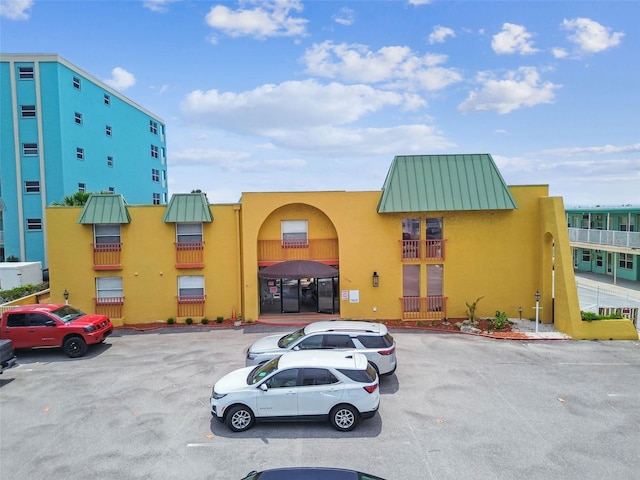 17248 Gulf Blvd Unit 12, North Redington Beach, FL 33708 - view of building exterior featuring uncovered parking