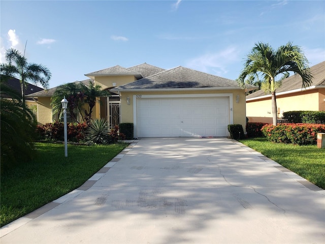 ranch-style house featuring a garage, concrete driveway, and stucco siding