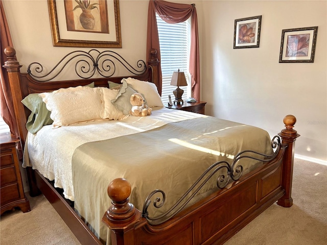 bedroom with carpet flooring and baseboards