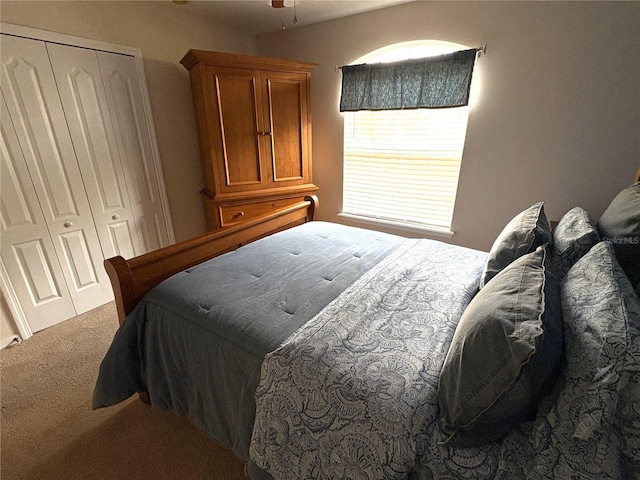 bedroom featuring a closet and carpet