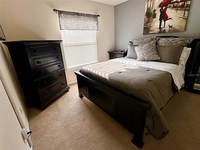 bedroom featuring light carpet