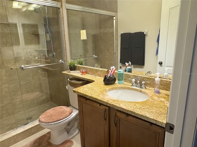 full bath featuring a stall shower, toilet, and vanity