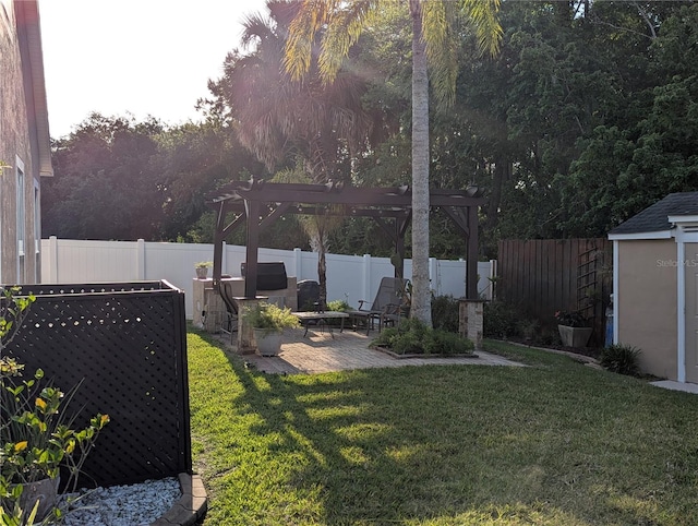view of yard with a pergola, a fenced backyard, and a patio area