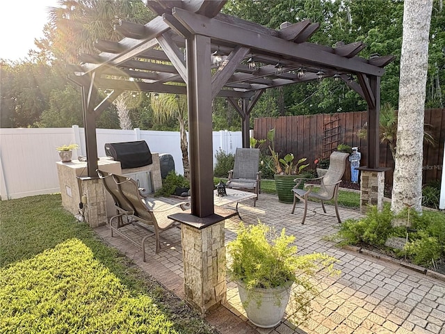 view of patio featuring a pergola and a fenced backyard