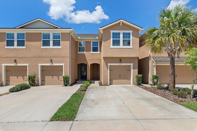 6225 Scarlet Darter Way, Tampa, FL 33625 - view of property with concrete driveway, stucco siding, and a garage
