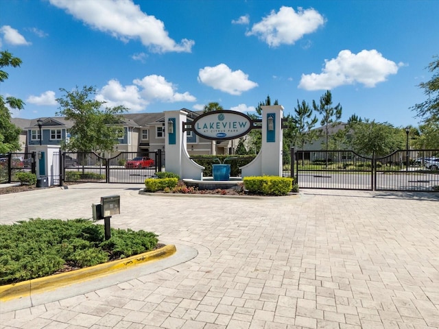 6225 Scarlet Darter Way, Tampa, FL 33625 - view of road with a gate, a gated entry, and curbs