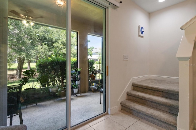 6225 Scarlet Darter Way, Tampa, FL 33625 - doorway to outside with light tile patterned floors, ceiling fan, stairs, and baseboards