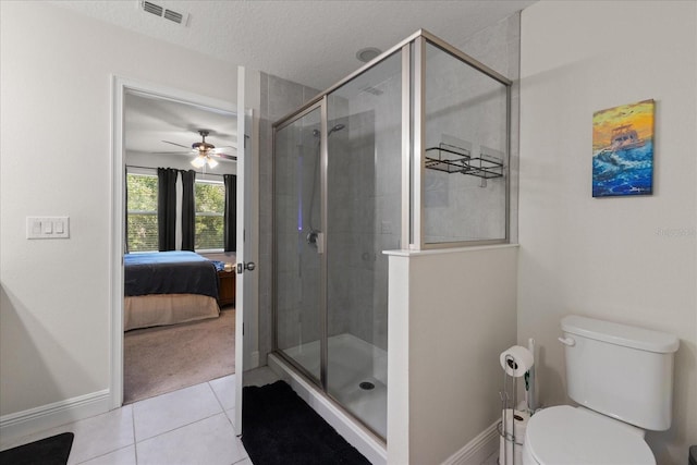 6225 Scarlet Darter Way, Tampa, FL 33625 - bathroom with tile patterned flooring, a shower stall, ensuite bath, baseboards, and a ceiling fan