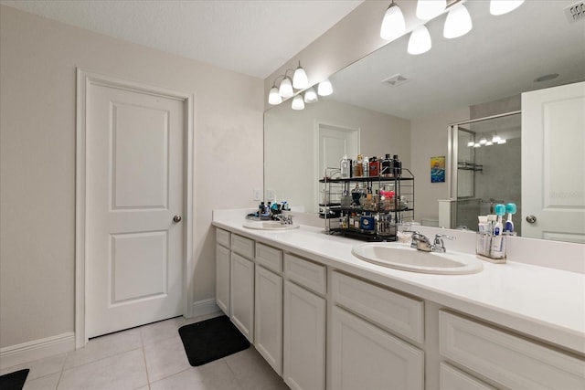 6225 Scarlet Darter Way, Tampa, FL 33625 - full bathroom with a shower stall, tile patterned floors, double vanity, and baseboards