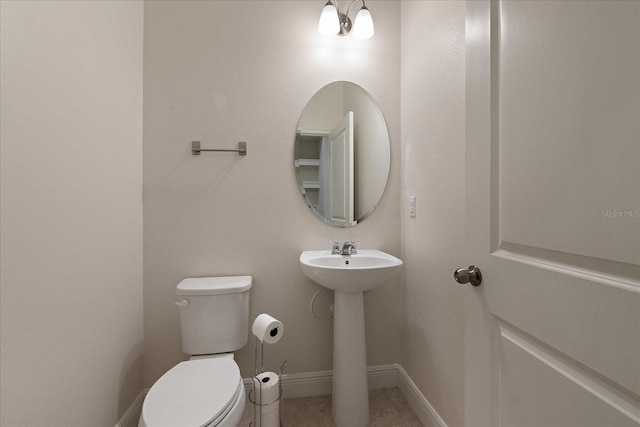 6225 Scarlet Darter Way, Tampa, FL 33625 - bathroom featuring toilet, baseboards, and a sink
