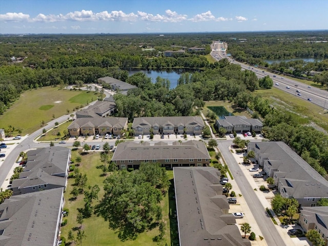 6225 Scarlet Darter Way, Tampa, FL 33625 - aerial perspective of suburban area with a nearby body of water and a heavily wooded area