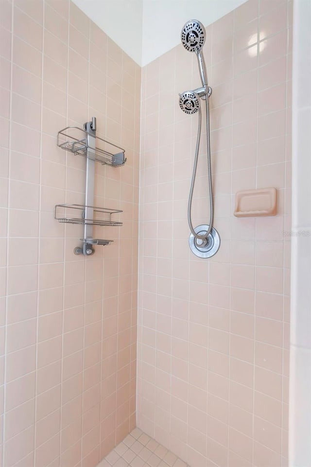 full bath featuring tiled shower