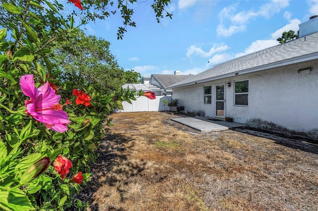 view of yard with a patio and fence