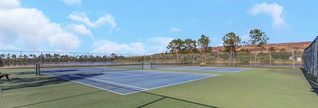 view of sport court featuring fence