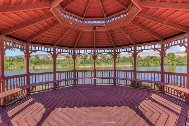 deck featuring a gazebo and a water view