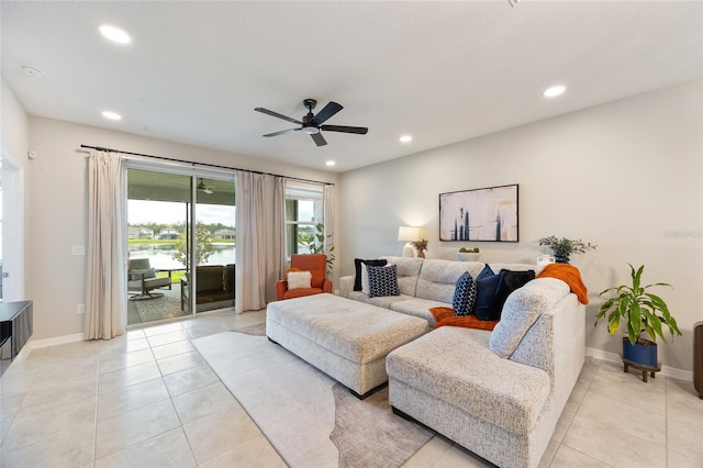 5059 Bromeliad Ave, Wimauma, FL 33598 - living area featuring light tile patterned flooring, recessed lighting, ceiling fan, baseboards, and a water view