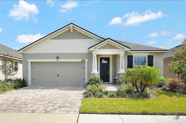 10729 Planer Picket Dr, Riverview, FL 33569 - view of front of property with a garage, stucco siding, and decorative driveway
