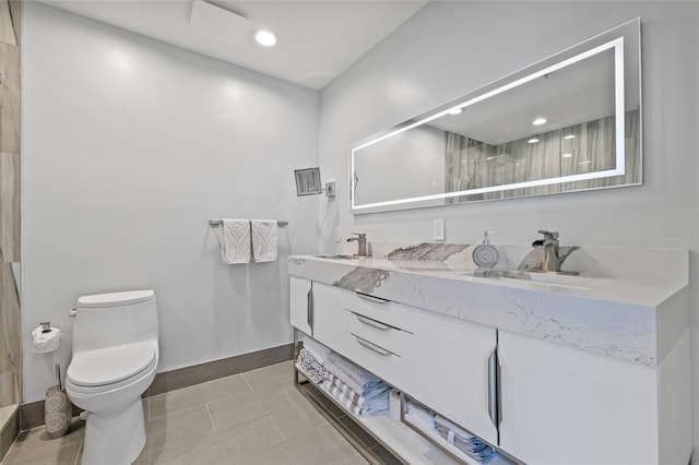 175 1st St S Unit 2603, Saint Petersburg, FL 33701 - full bathroom featuring baseboards, toilet, double vanity, and a sink