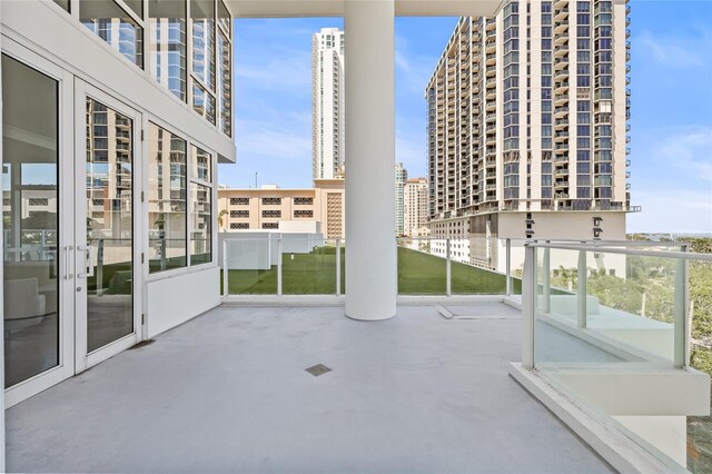175 1st St S Unit 2603, Saint Petersburg, FL 33701 - view of patio / terrace featuring a city view, french doors, and a balcony