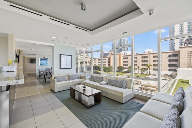 175 1st St S Unit 2603, Saint Petersburg, FL 33701 - living room featuring a healthy amount of sunlight, a city view, and tile patterned flooring