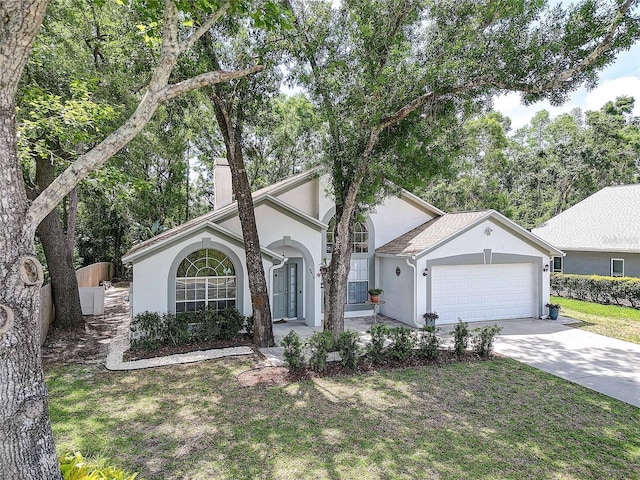 6410 Beaver Way, Tampa, FL 33625 - ranch-style home featuring stucco siding, an attached garage, and driveway