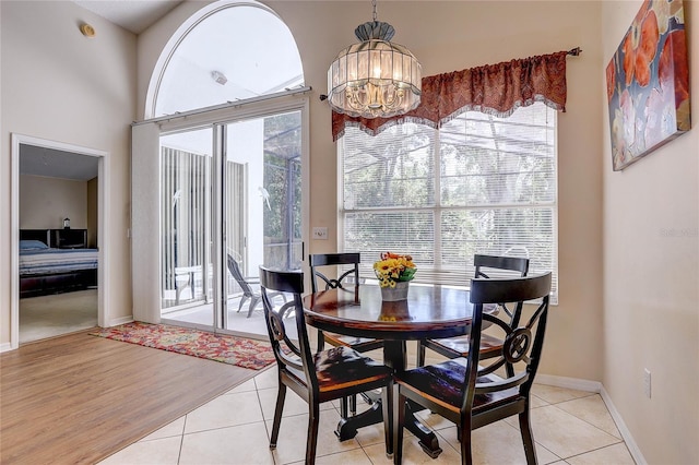 6410 Beaver Way, Tampa, FL 33625 - dining space featuring an inviting chandelier, baseboards, and light tile patterned floors