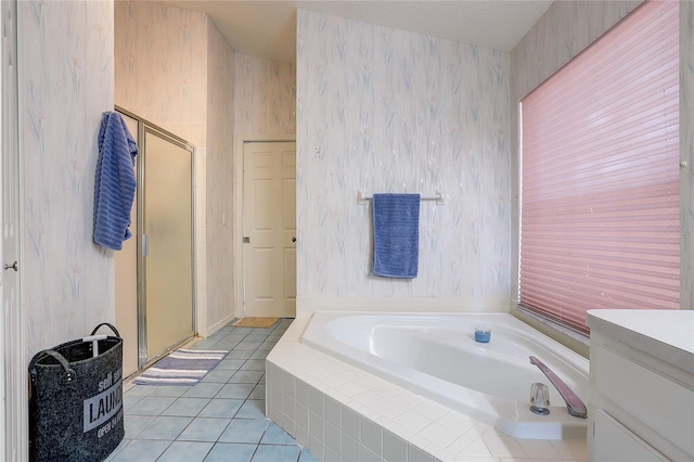 6410 Beaver Way, Tampa, FL 33625 - bathroom with vanity, tile patterned flooring, a garden tub, and a stall shower
