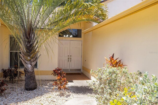 1916 Sandstone Pl, Clearwater, FL 33760 - entrance to property featuring stucco siding