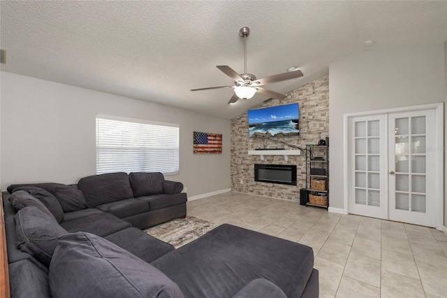 1916 Sandstone Pl, Clearwater, FL 33760 - living area with ceiling fan, a textured ceiling, a stone fireplace, light tile patterned floors, and vaulted ceiling
