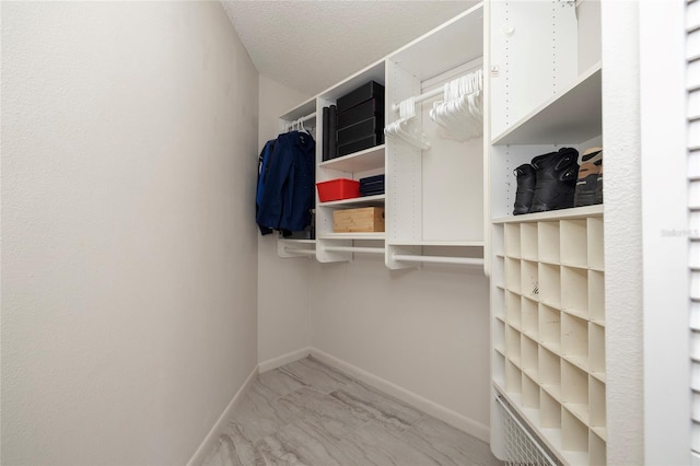 1916 Sandstone Pl, Clearwater, FL 33760 - walk in closet featuring marble finish floor