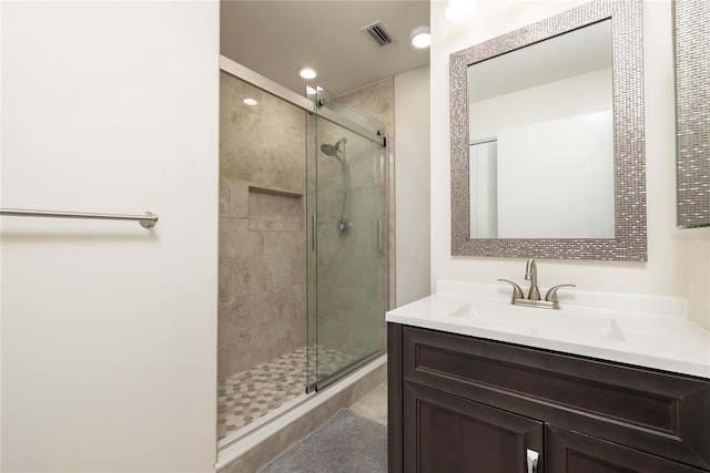 1916 Sandstone Pl, Clearwater, FL 33760 - bathroom featuring vanity, a stall shower, recessed lighting, and visible vents