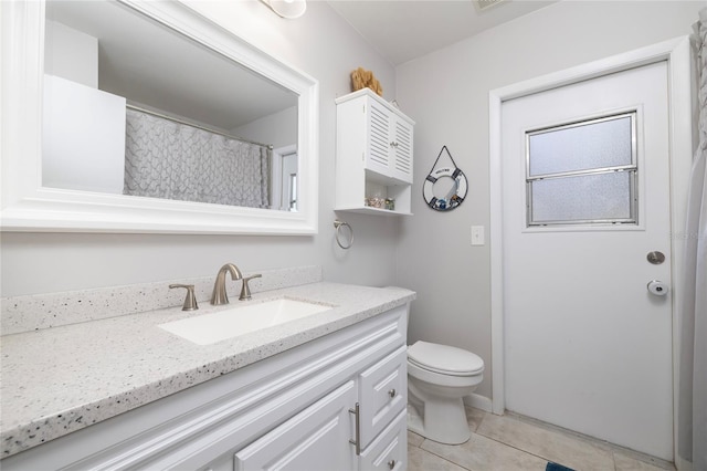 1916 Sandstone Pl, Clearwater, FL 33760 - bathroom with tile patterned floors, vanity, toilet, and visible vents