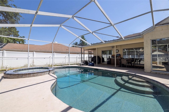 1916 Sandstone Pl, Clearwater, FL 33760 - view of swimming pool featuring a patio, glass enclosure, fence, and a pool with connected hot tub