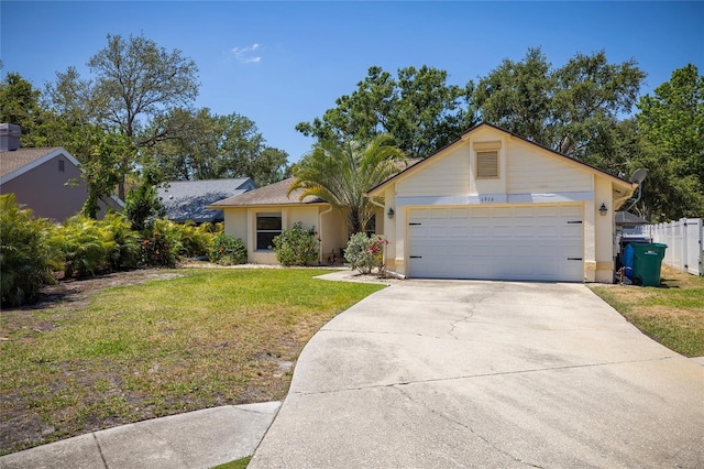 1916 Sandstone Pl, Clearwater, FL 33760 - view of front of house featuring an attached garage, stucco siding, driveway, and a front yard