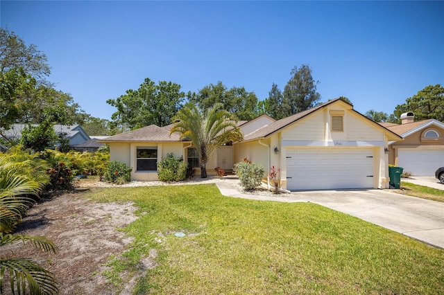 1916 Sandstone Pl, Clearwater, FL 33760 - ranch-style house featuring an attached garage, driveway, a front yard, and stucco siding