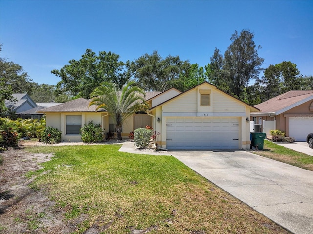 1916 Sandstone Pl, Clearwater, FL 33760 - single story home with stucco siding, driveway, a front yard, and a garage