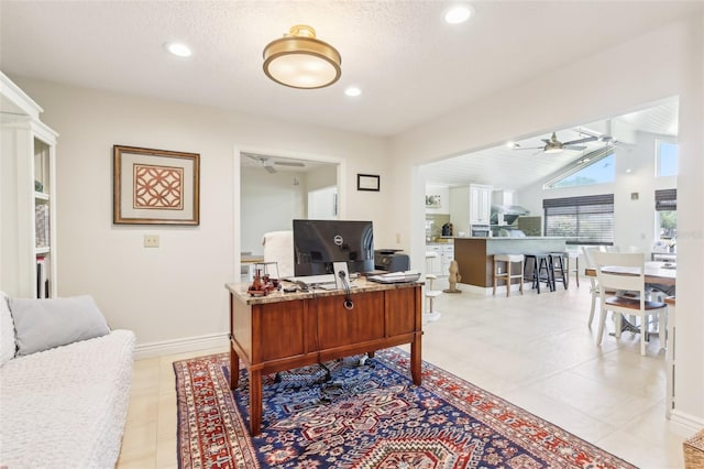office space featuring lofted ceiling, recessed lighting, a ceiling fan, light tile patterned floors, and baseboards