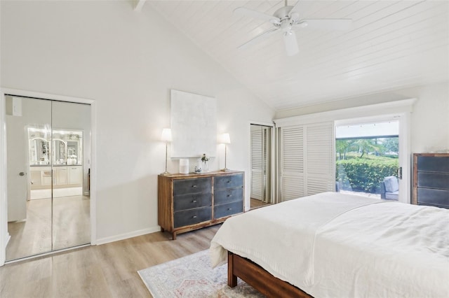 bedroom featuring wood finished floors, a ceiling fan, high vaulted ceiling, baseboards, and beamed ceiling